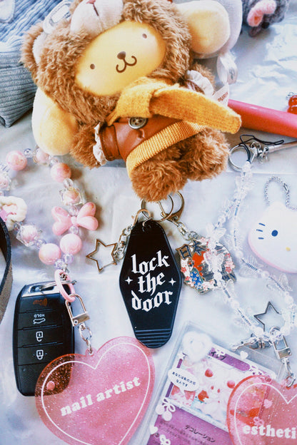 Collection of keychains and accessories on a light surface